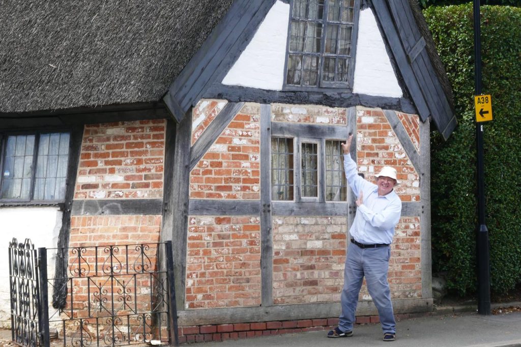 William in front of a Tudor House